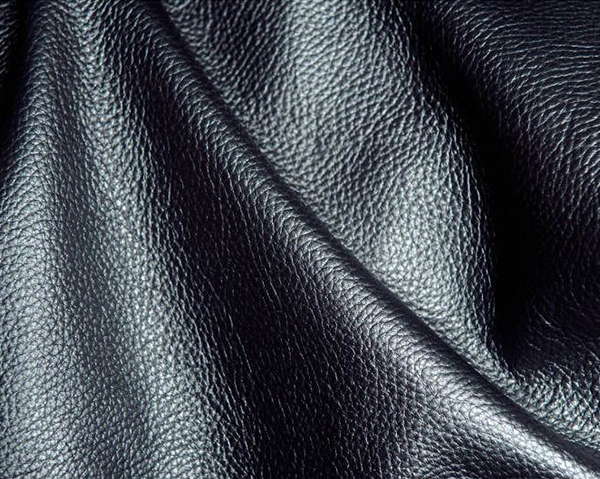 Textured black leather with a visible grain, possibly cow milled.